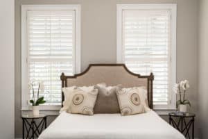 White, Hardwood Plantation Shutters with 3.5 inch louvers and divider rails in a Sandy Springs, GA guest bedroom