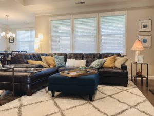 White, Corded, Real Wood Blinds with 2.5 inch slats in a spacious Cumming, GA living room