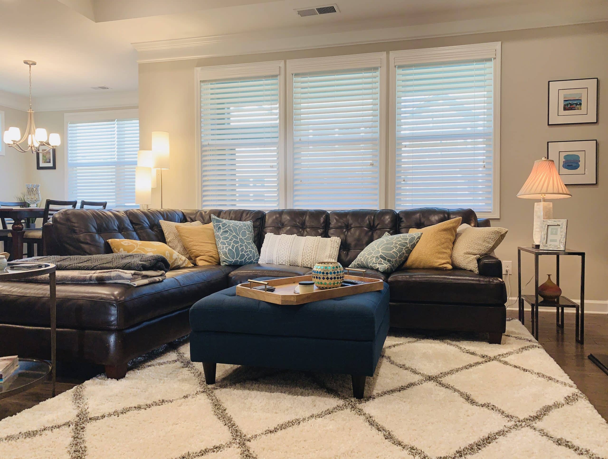 White, Corded, Real Wood Blinds with 2.5 inch slats in a spacious Cumming, GA living room