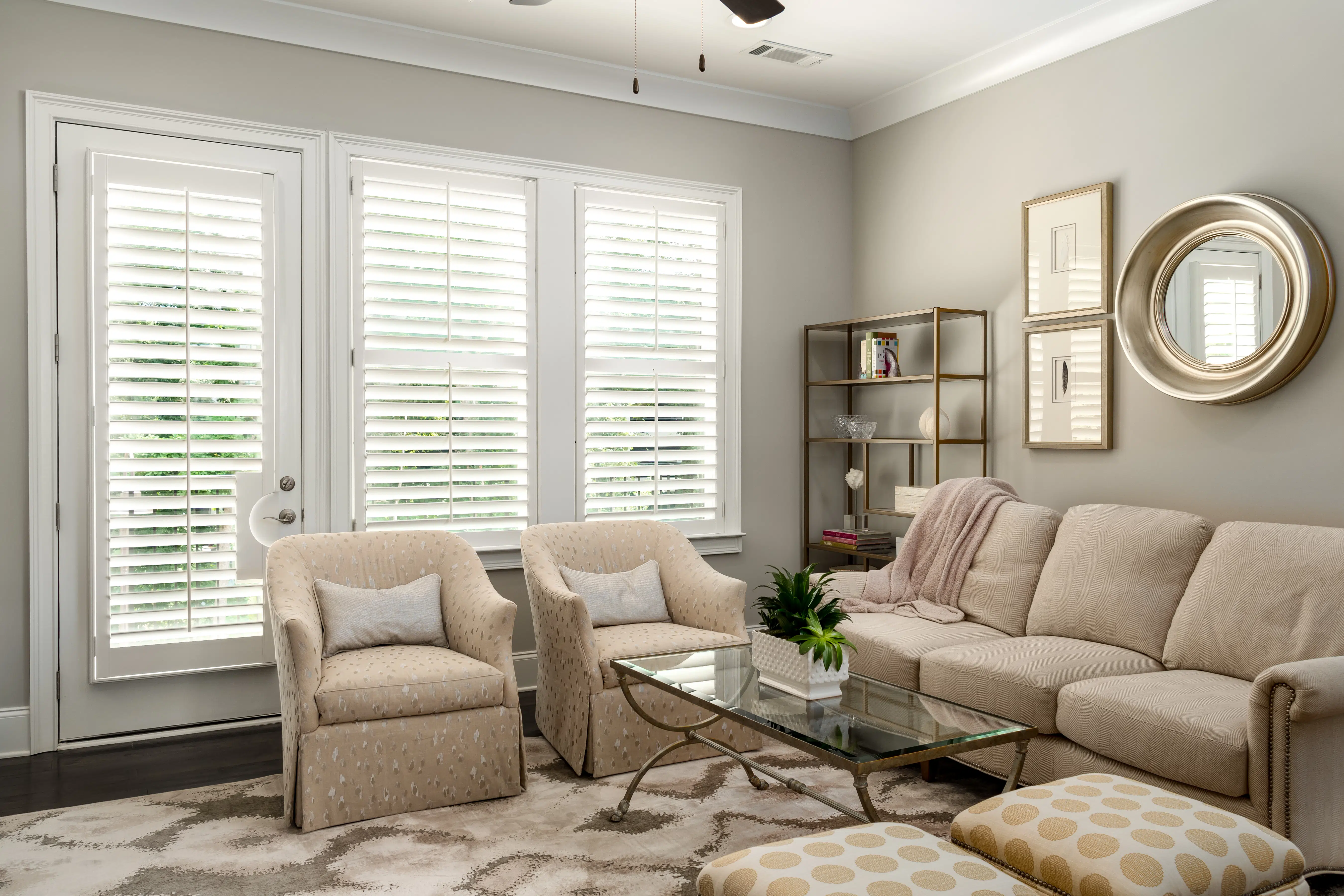 White Hardwood Plantation Shutters featuring 3.5 inch louvers and divider rails in a cozy Sandy Springs, GA living room