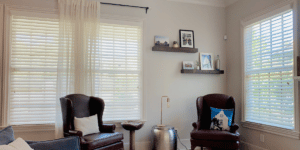 White, Corded Faux Wood Blinds featuring 2.5 inch slats in a neutral-toned family room