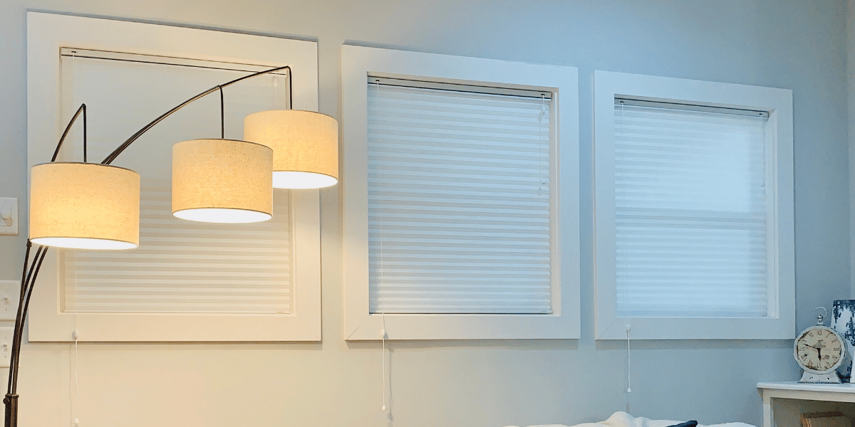 Cellular Shades, also known as Honeycomb Shades, cover three windows in a Nashville, TN living room