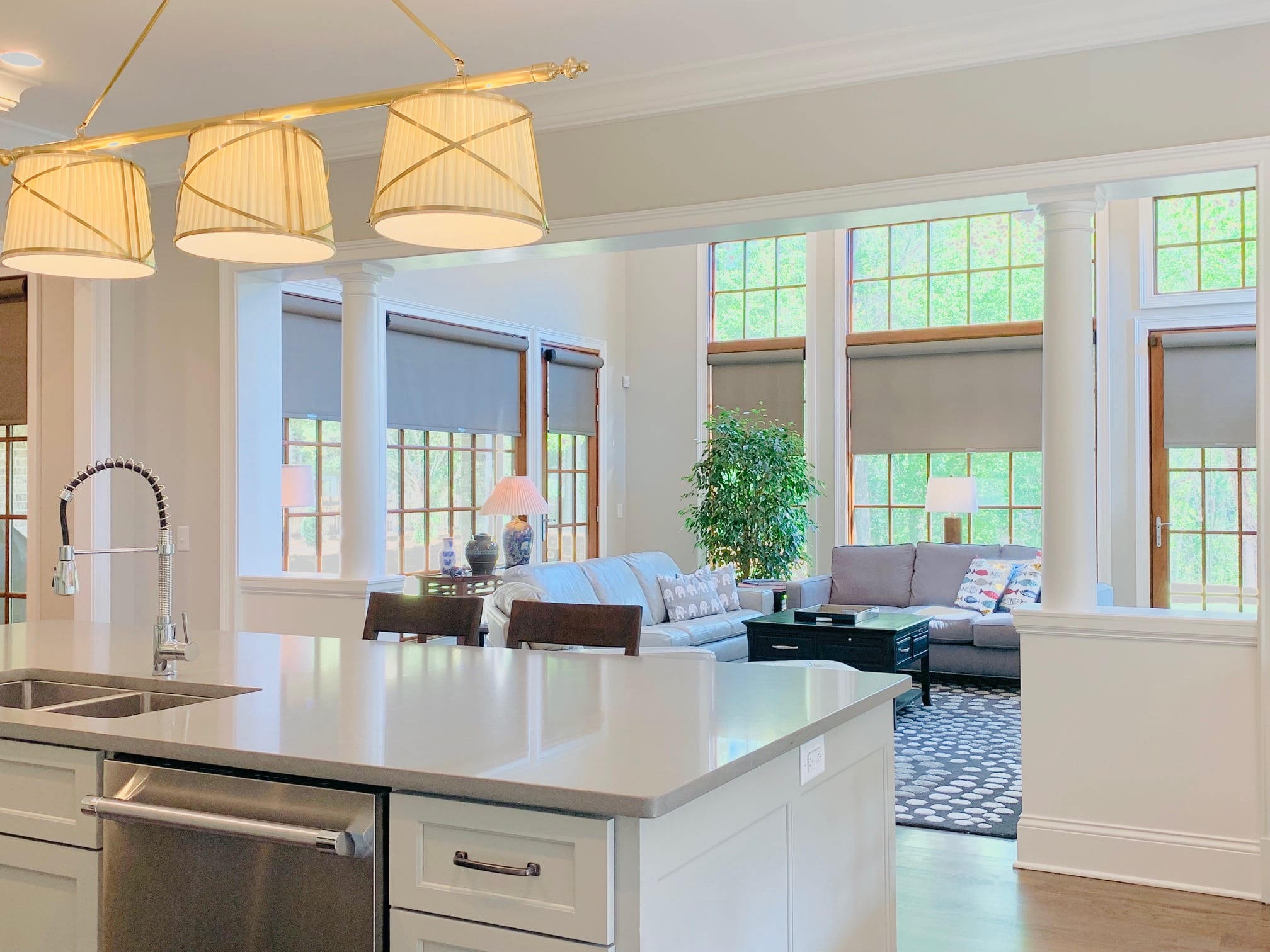 Grey Roller Shades featuring cordless smart control, in a spacious and open Dunwoody, GA great room