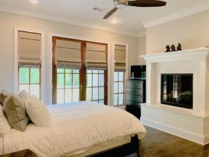 Classic grey Roller Shades on two windows and a french door in a cozy Dunwoody, GA bedroom