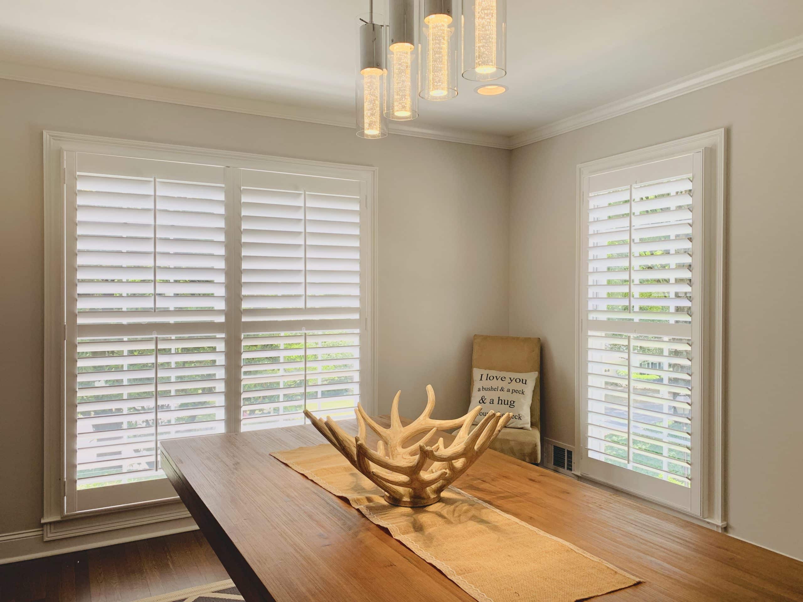 White Hardwood Plantation Shutters with 3.5 inch louvers and divider rails in a newly renovated Sandy Springs, GA dining room