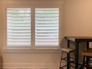 Hardwood Plantation Shutters featuring 4.5 inch louvers and a hidden tilt rod, also known as Superview Shutters, in a renovated Nashville, TN bungalow