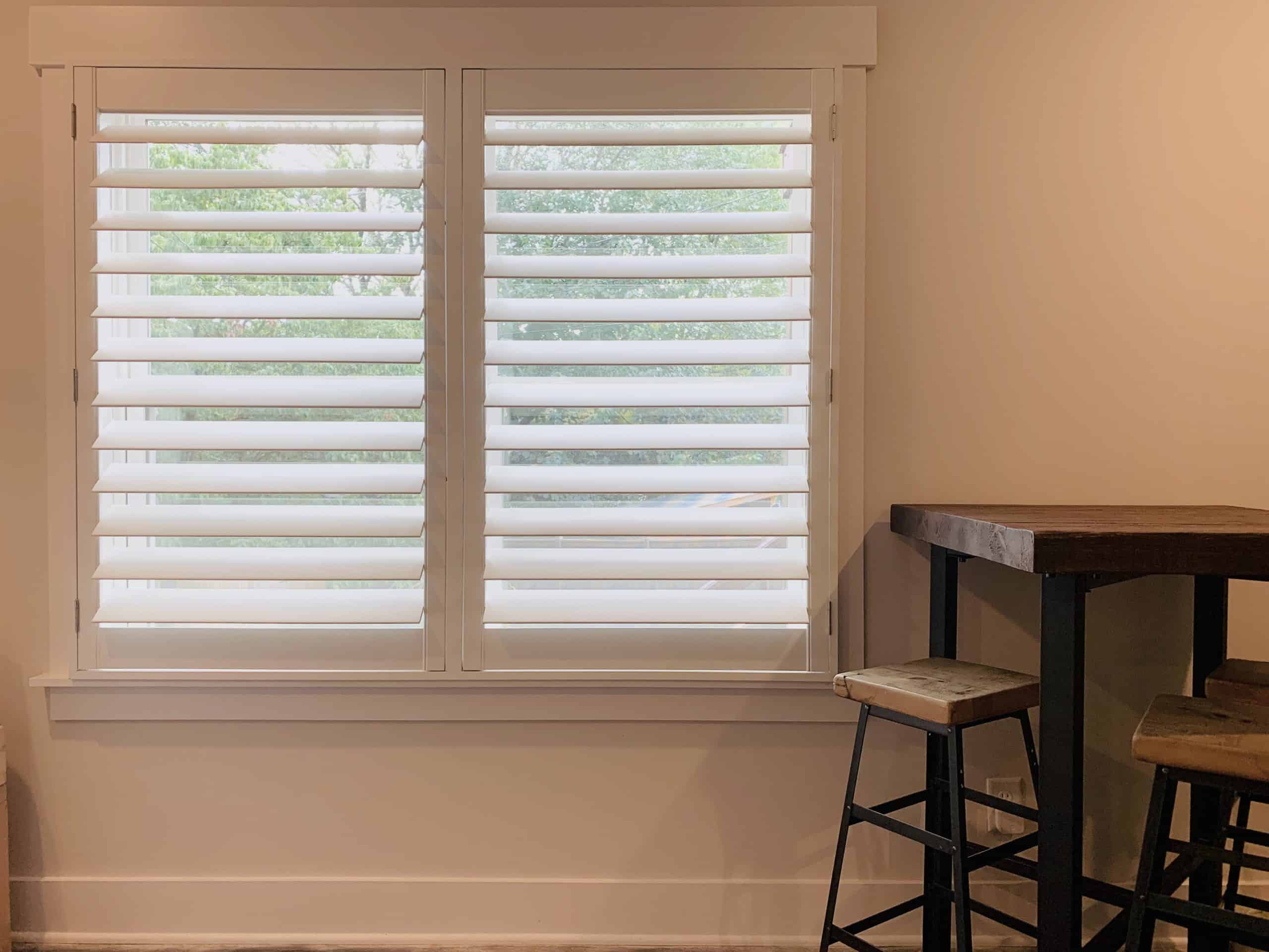 Hardwood Plantation Shutters featuring 4.5 inch louvers and a hidden tilt rod, also known as Superview Shutters, in a renovated Nashville, TN bungalow