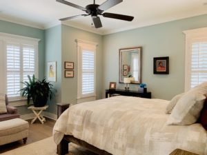 White Plantation Shutters with 3.5 inch louvers and divider rails in a Decatur, GA master bedroom