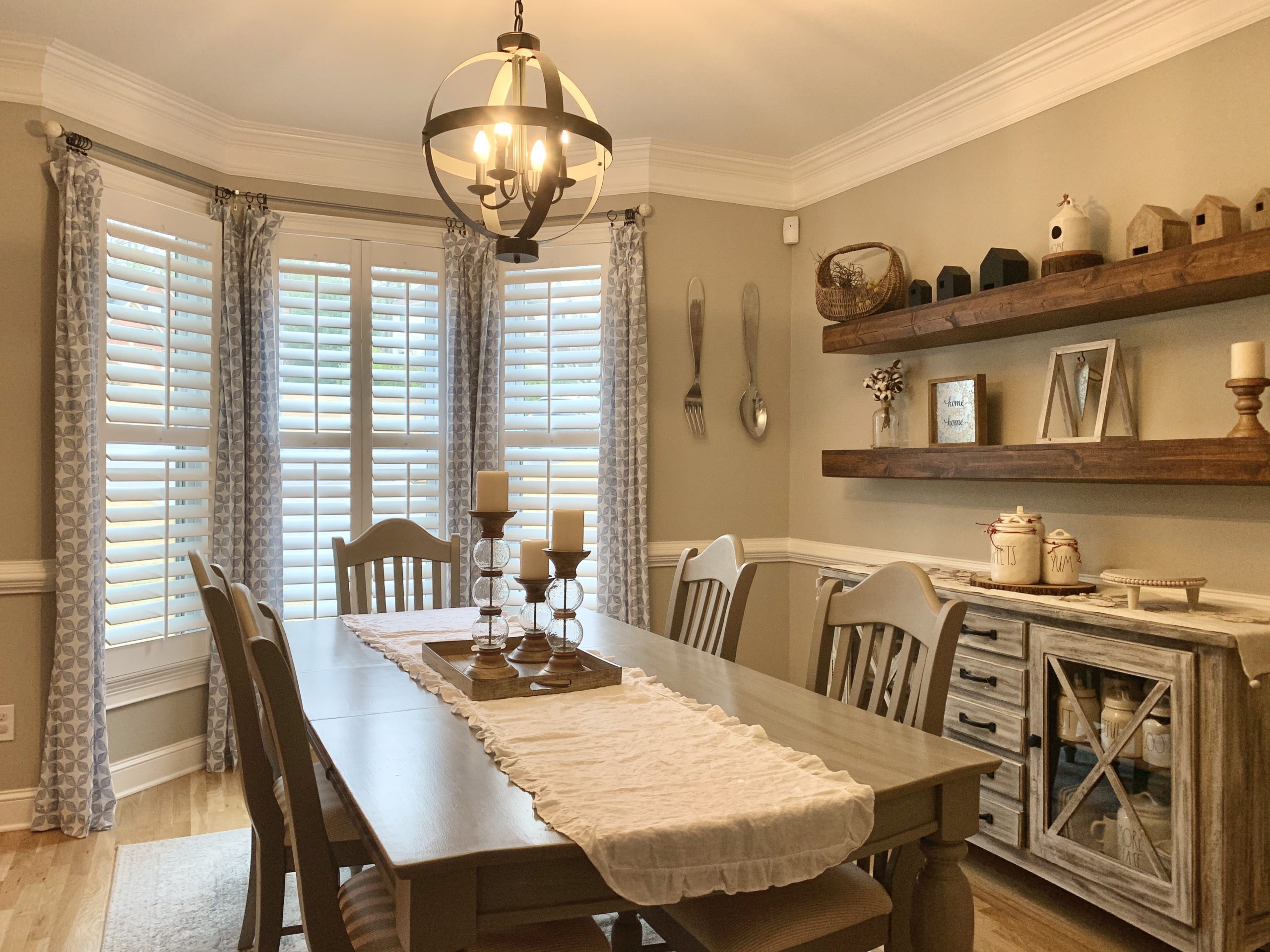 White Hardwood Plantation Shutters with 3.5 inch louvers and divider rails in a Decatur, GA dining room