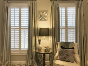 White Hardwood Plantation Shutters with 3.5 inch louvers and divider rails in a Decatur, GA reading room