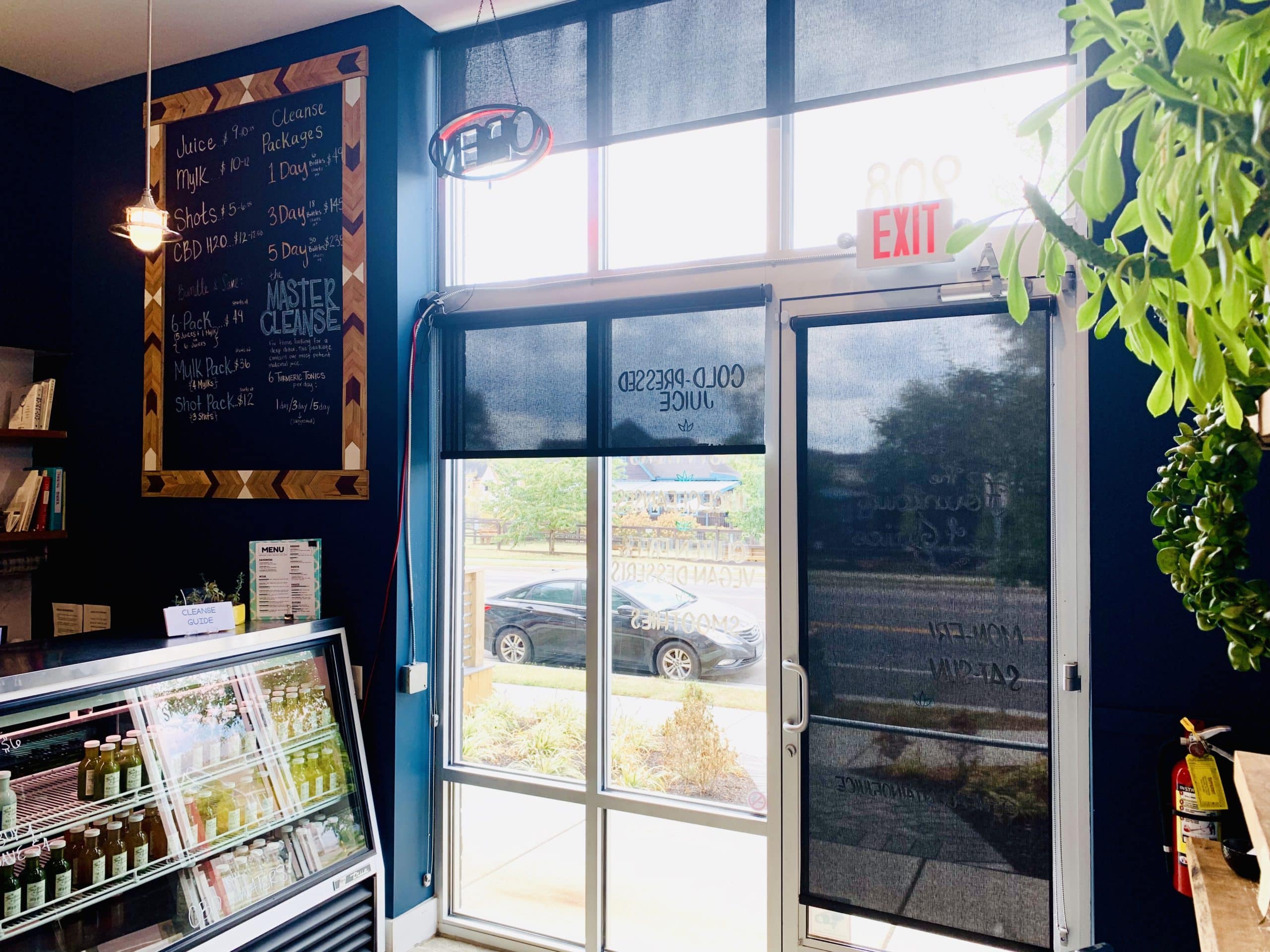 Dark Roller Shades adorn the front windows and door of juice retailer in Nashville, TN