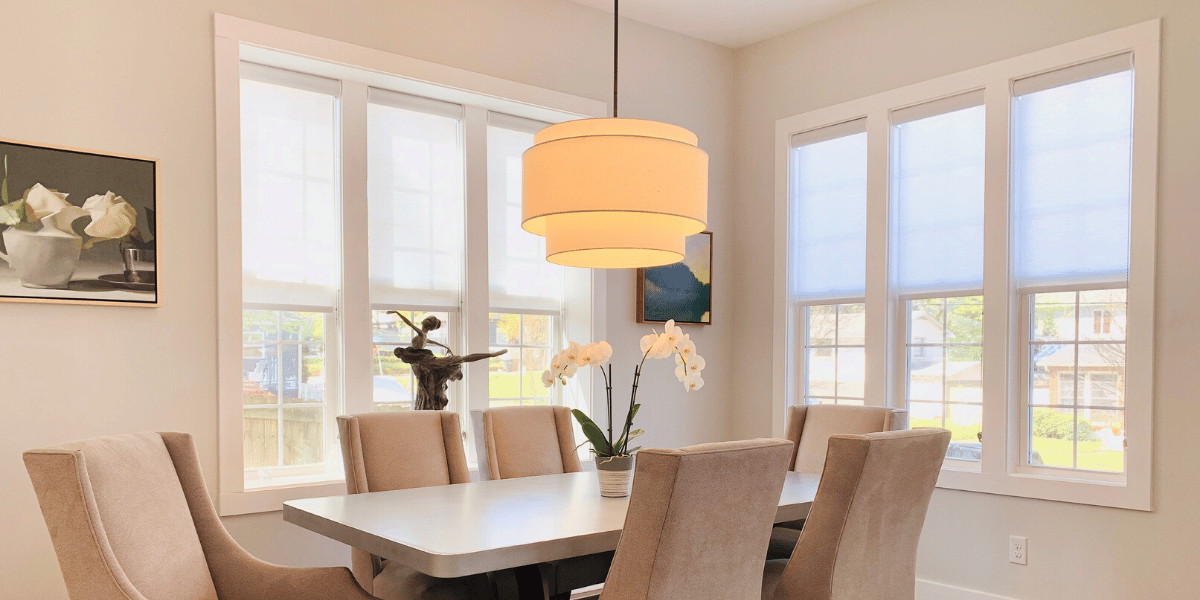 Gray Roller Shades lifted to expose windows, in an Atlanta, GA dining room