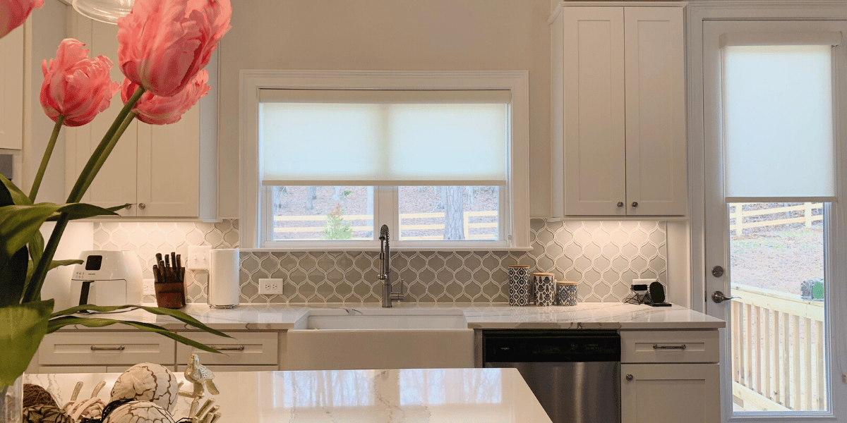 Light Filtering Roller Shades raised to expose windows in a Roswell, GA kitchen