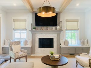 Grey Natural Woven Shades, also known as Tropical Woven Shades, with edge banding, in a living room in Atlanta, GA