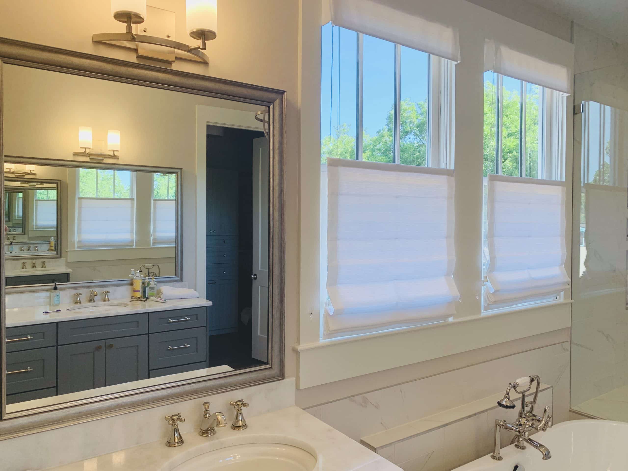 Roman Shades featuring top down, bottom up lift functionality in a marble bathroom in Atlanta, GA