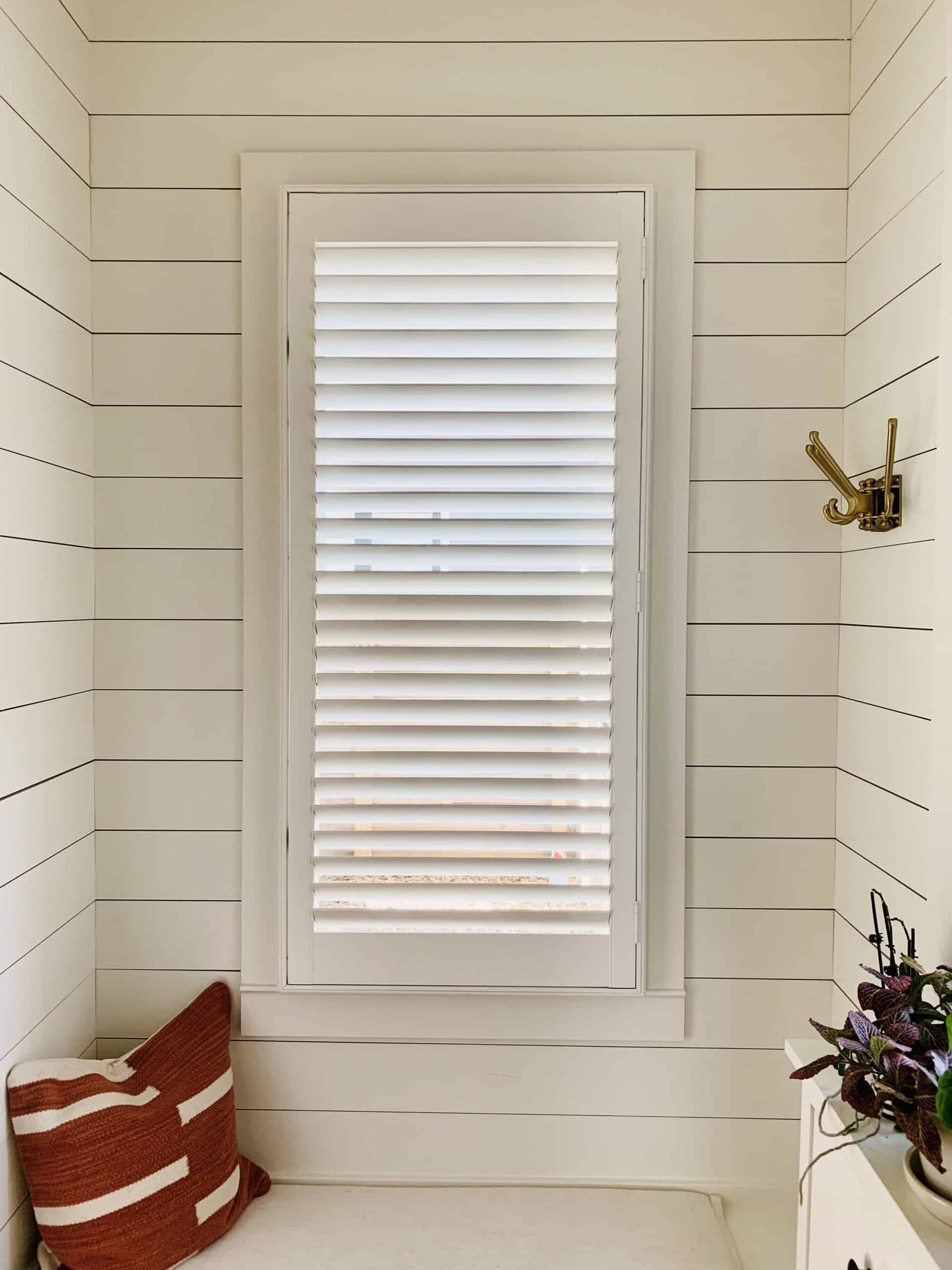 Hardwood Plantation Shutters featuring 2.5 inch louvers and a hidden tilt rod, also known as Superview Shutters, in an Atlanta, GA mudroom