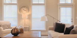 Real Wood Blinds featuring 2.5 inch slats on three large windows in an open-concept Decatur, GA living room