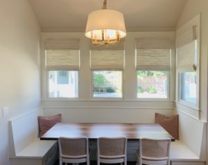 Beige Natural Woven Shades filter light from four windows in a breakfast nook in Atlanta, GA