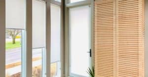 Roller Shades add a sleek, modern touch to these long, rectangular windows in a modern entryway