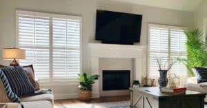 Hardwood Plantation Shutters featuring 3.5 inch louvers and split tilt rods in a spacious and contemporary Nashville, TN great room