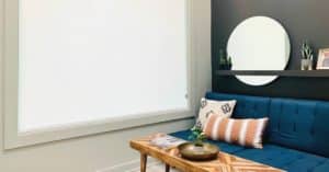White Motorized Roller Shades cover a large window in a modern living space in Nashville, TN