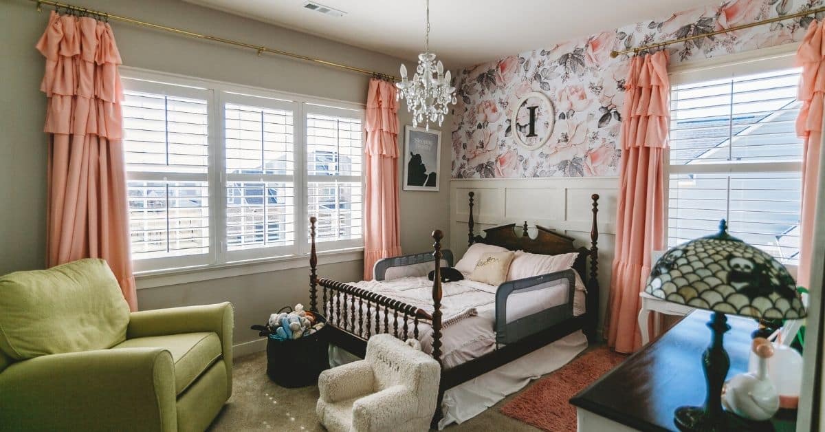 White, Hardwood Plantation Shutters featuring 3.5 inch louvers and divider rails in a colorful child's bedroom in Mount Juliet, TN