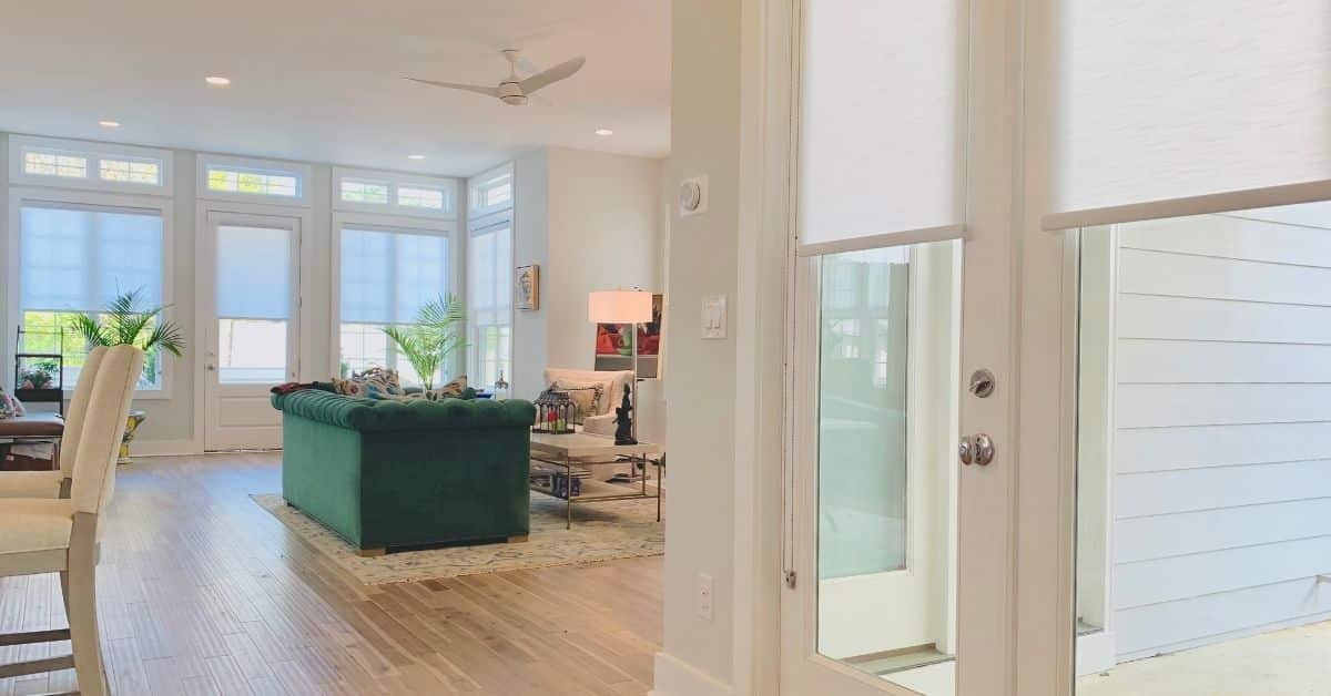 Light Filtering Roller Shades lifted to expose windows in an Atlanta, GA living room