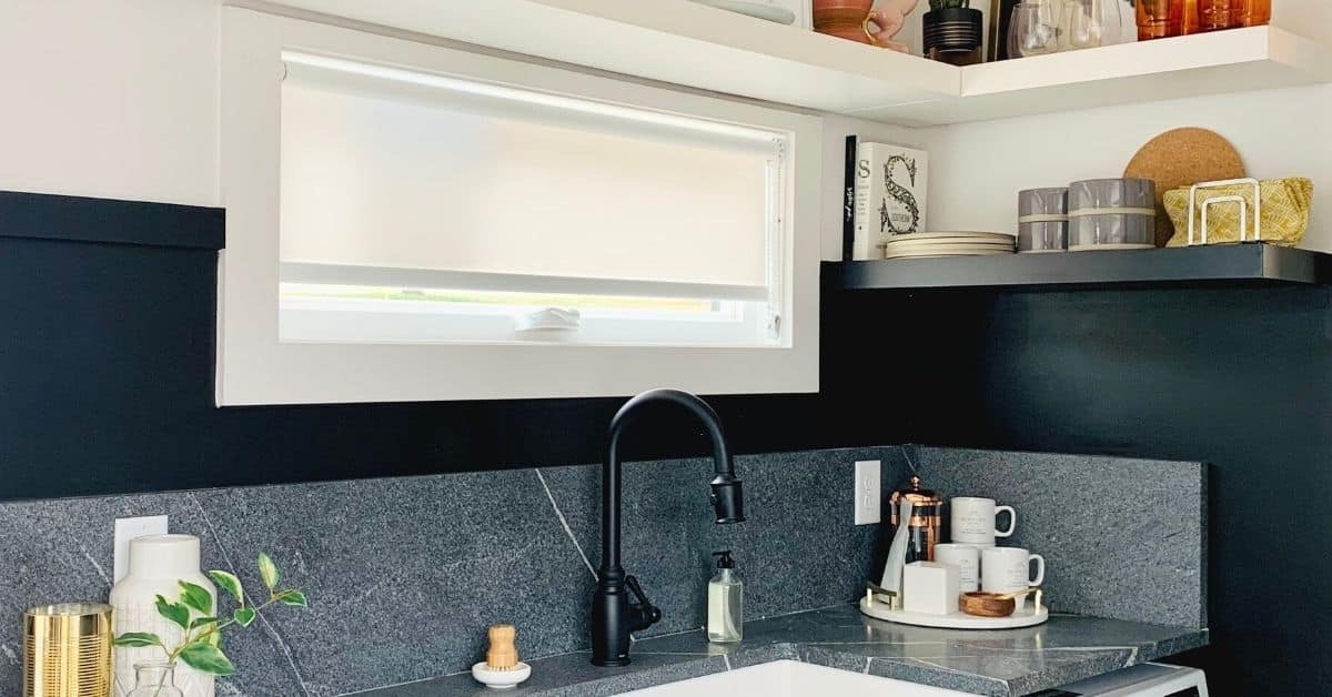 White Custom Roller Shade gently diffuses light into this modern kitchen with charcoal trim
