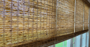 Dark Natural Woven Shades, also known as Tropical Woven Shades, lifted to expose windows in a Franklin, TN home