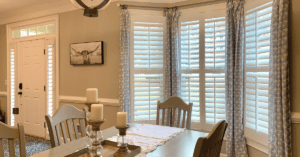 White, Hardwood Plantation Shutters featuring 3.5 inch louvers and split tilt rods in an Alpharetta, GA dining room