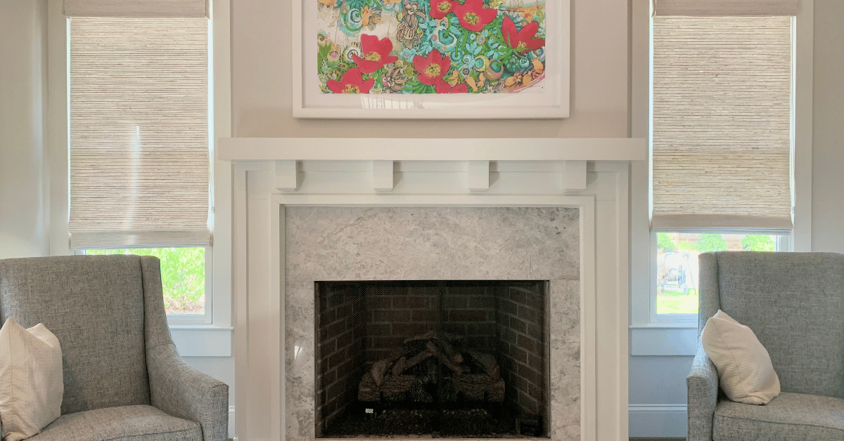 Beige Natural Woven Shades lifted slightly on two large windows in a contemporary and spacious Atlanta, GA living room