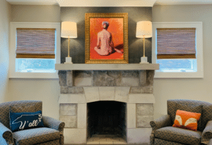 Beautiful natural woven shades set against a stone fireplace.