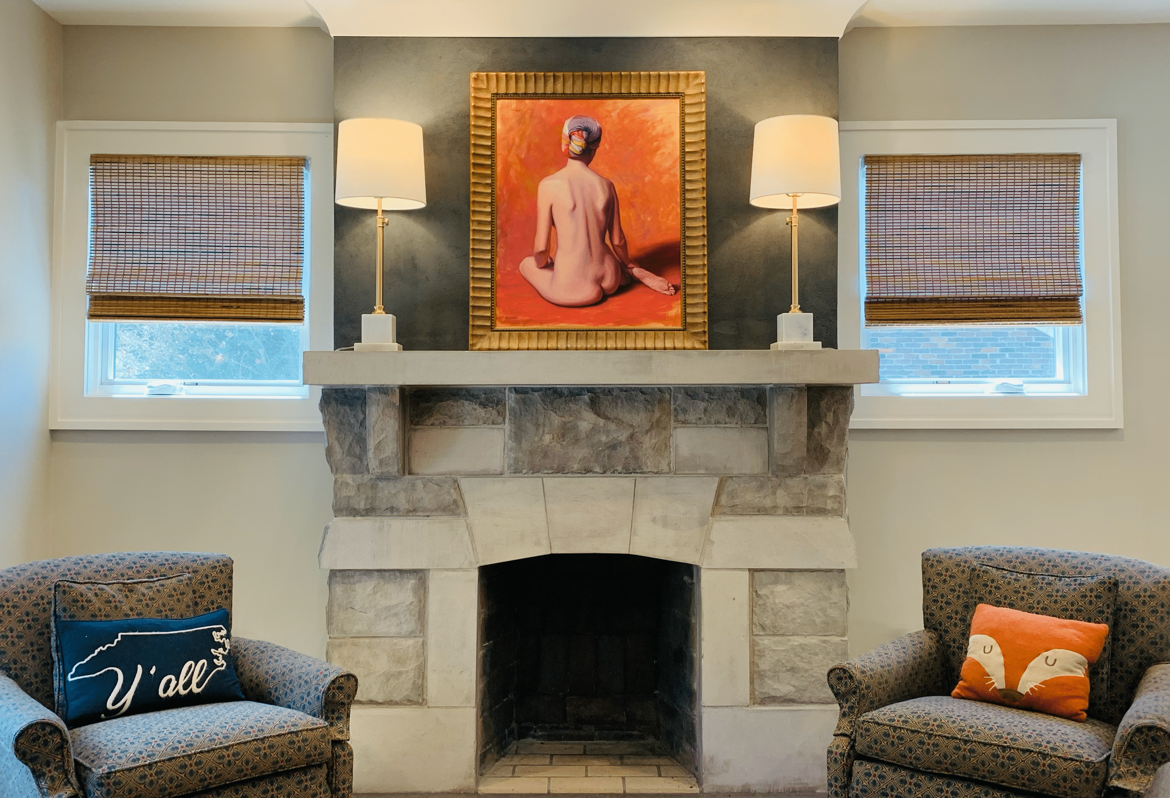 Beautiful natural woven shades set against a stone fireplace.